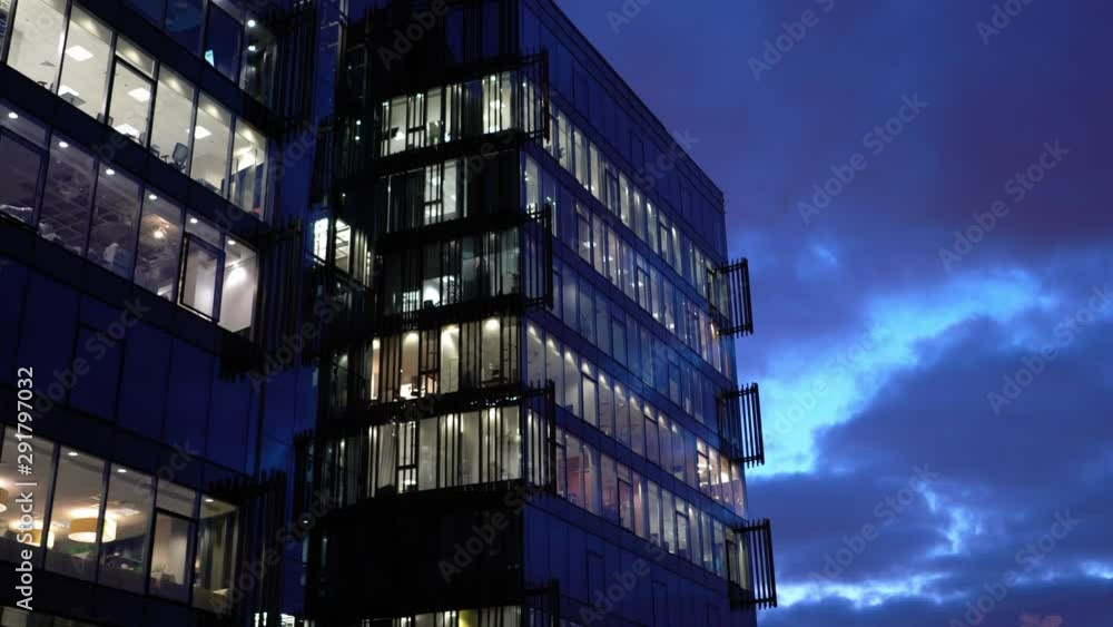 Office building exterior detail Night city. Evening city skyline. slow forward zoom in shot Office building exterior detail Night city. Evening city skyline. slow forward zoom in shot