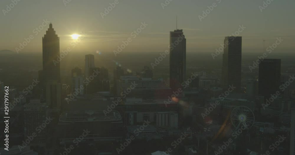 Sun sets beyond downtown Atlanta skyline, helicopter aerial Sun sets beyond downtown Atlanta skyline, helicopter aerial