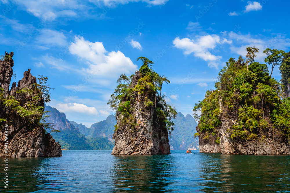 Amazing Limestone Karsts of Cheow Lan Lake with Blue Sky and Clouds at Ratchaprapha Dam, Khao Sok National Park Thailand Amazing Limestone Karsts of Cheow Lan Lake with Blue Sky and Clouds at Ratchaprapha Dam, Khao Sok National Park Thailand