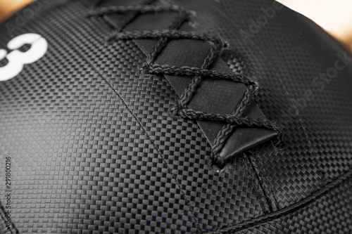 Medicine ball of black color. Genuine leather, lacing. photo