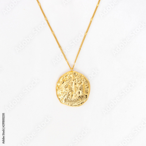 Vintage gold pendant necklace on gold chain, isolated