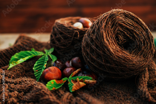 Handmade knitted clothes. Brown aran sweater with chestnuts and cinnamon.