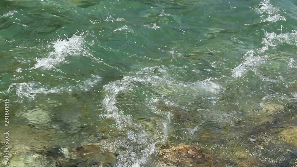 Closeup of fast flowing stream. Bubbles and foam on water surface, Closeup of fast flowing stream. Bubbles and foam on water surface,