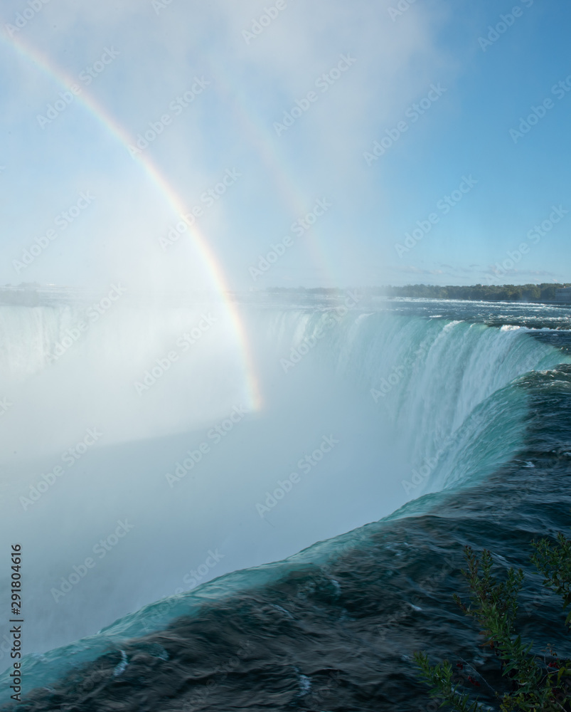 Fototapeta premium A rainbow forms at Niagara Falls