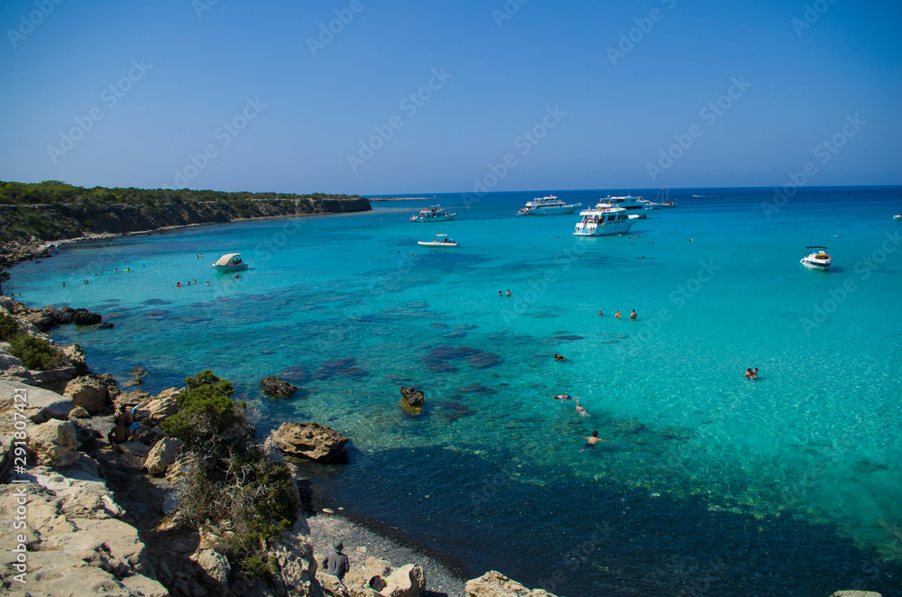 The Blue Lagoon with the people and boats at the summer sunny day, concept of a vacation
