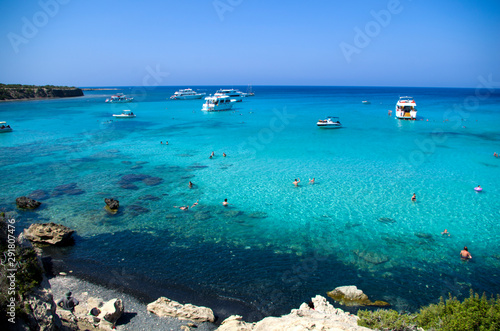 The Blue Lagoon with the people and boats at the summer sunny day, concept of a vacation