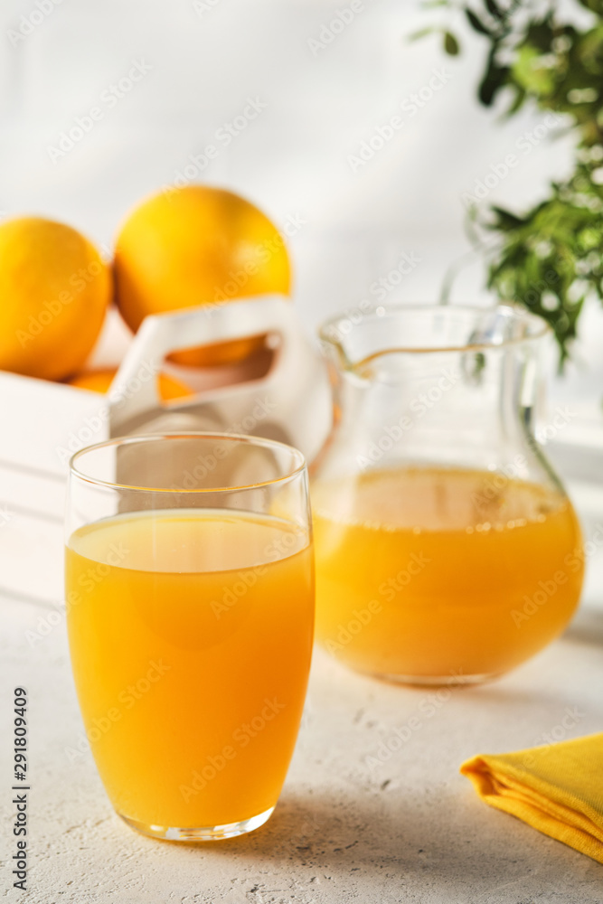 Fototapeta premium Fresh Squeezed Orange Juice with Fresh Fruits.
