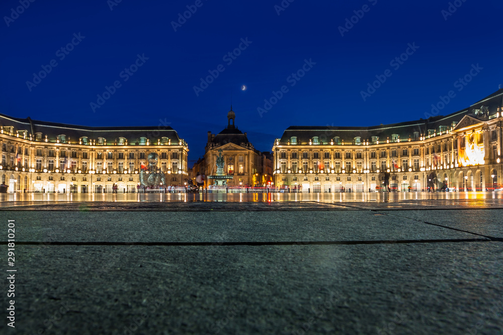 Place de la Bourse in the city of Bordeaux, France with reflection from water fountain