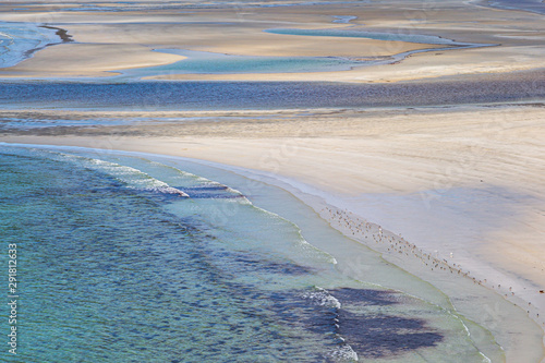 A full frame photograph of white sands and turquoise sea at Seilebost Beach on the Isle of Harris