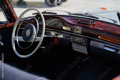 Vintage retro car interior, close-up. Old automobile steering wheel © Gecko Studio