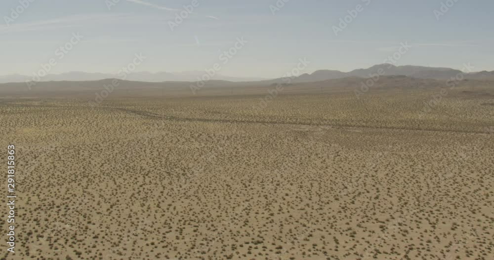 Aerial shot, day, high altitude shot of desert with shrubbery, drone Aerial shot, day, high altitude shot of desert with shrubbery, drone