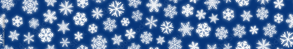 Fototapeta premium Christmas horizontal seamless banner of white snowflakes on blue background