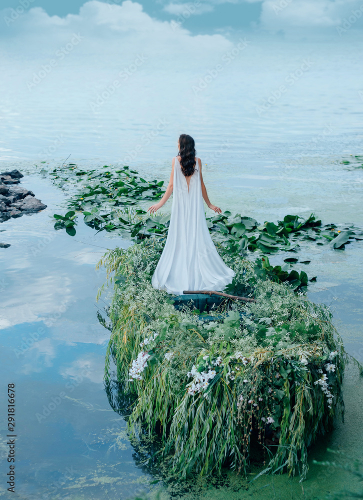 A mysterious woman in a long white dress is floating in a boat to meet ...