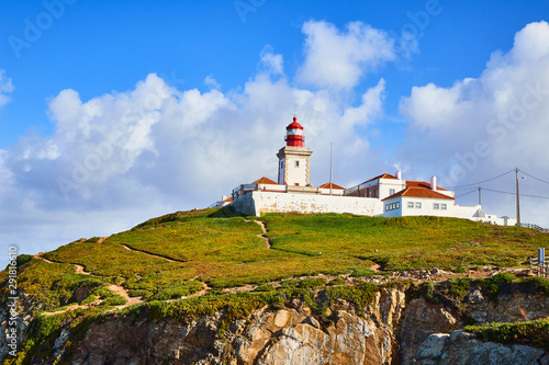 Cabo da Roca, Portugal. Lighthouse and cliffs over Atlantic Ocean, the most westerly point of the European mainland. © bondvit