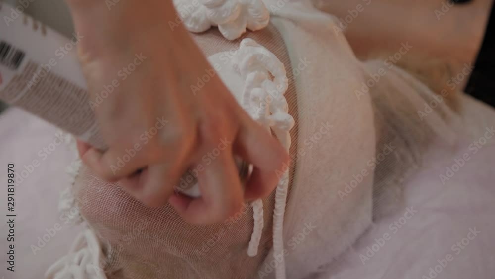 Professional beautician applies a foam mask to the face. Professional beautician applies a foam mask to the face.