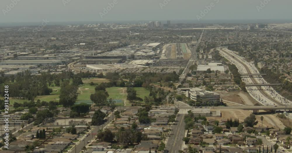 Aerial shot, day, high altitude view of golf course in la, santa monica airport in distance, drone Aerial shot, day, high altitude view of golf course in la, santa monica airport in distance, drone