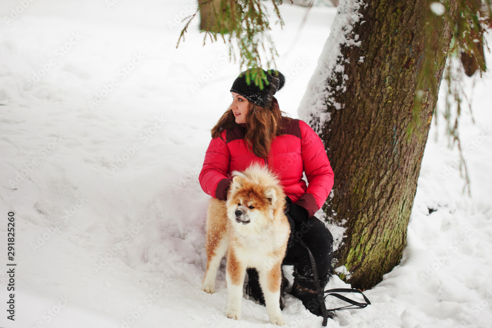 Portrait with a cute fluffy puppy. Winter walk with a dog.