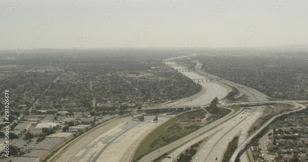 Aerial shot, day, high altitude view of highways and manmade river, california neighborhood, drone Aerial shot, day, high altitude view of highways and manmade river, california neighborhood, drone