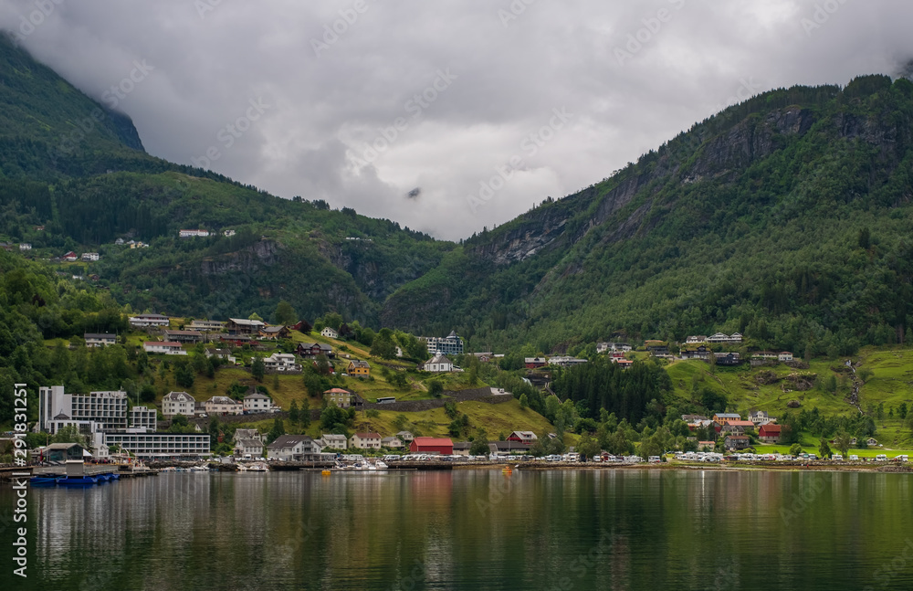 GEIRANGER, NORWAY - JULY 2019: View from above over the small town of Geiranger, Norway