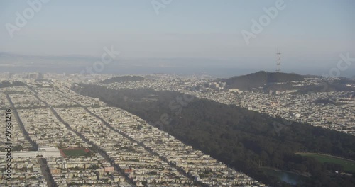 Aerial shot, day, high altitude view of residential section in north california, bay in background, drone