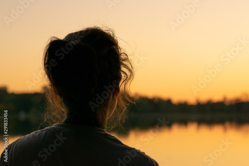 Girl looking at sunset