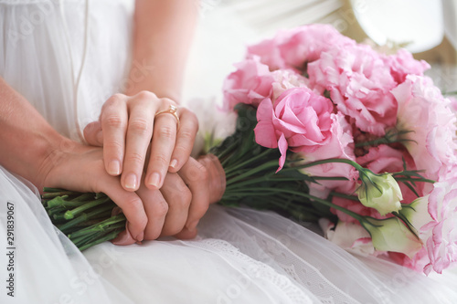 Beautiful young bride with bouquet  closeup