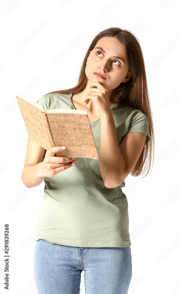 Thoughtful young girl with book on white background Thoughtful young girl with book on white background