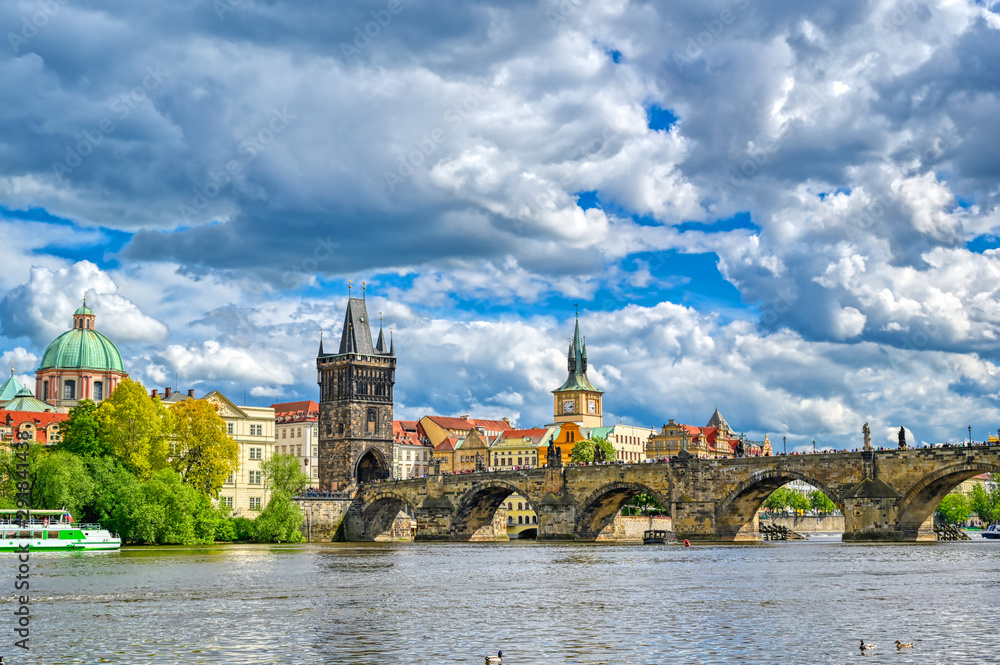 A view of Old Town Prague and the Charles Bridge across the Vltava River in Prague, Czech Republic.