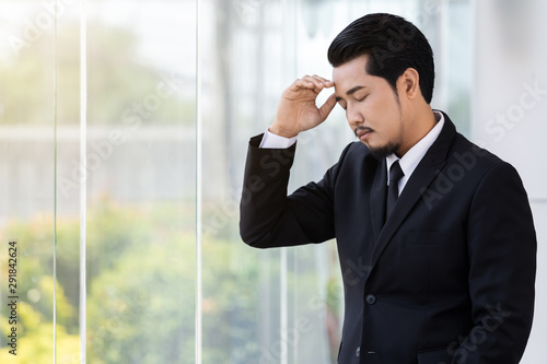 stressed business man thinking about problem in office