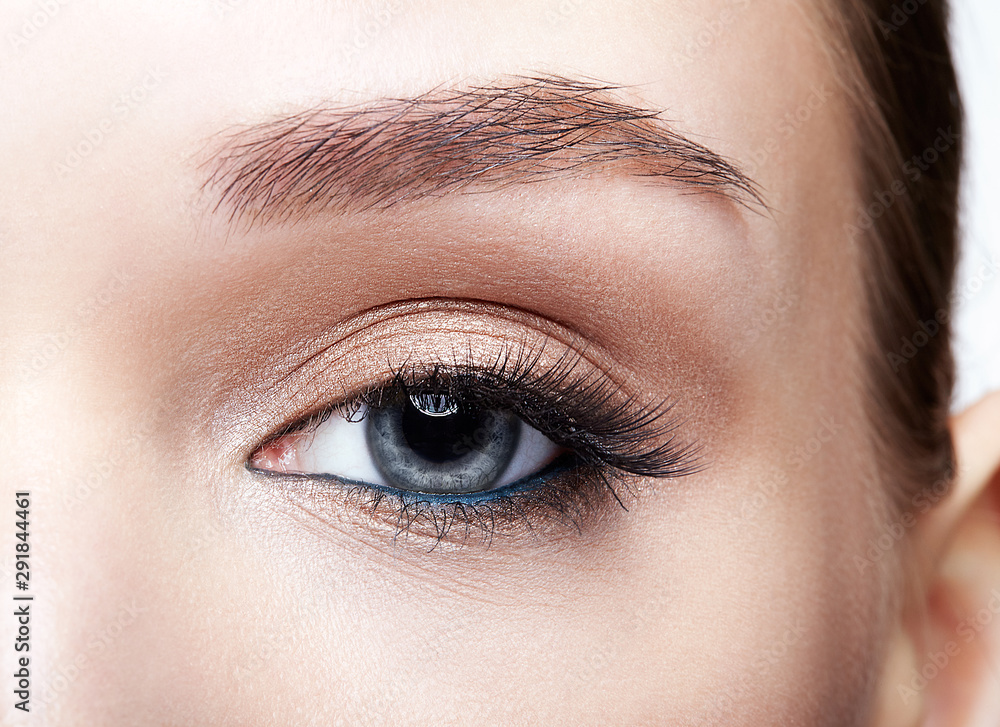 Fototapeta premium Closeup macro shot of blue human woman eye