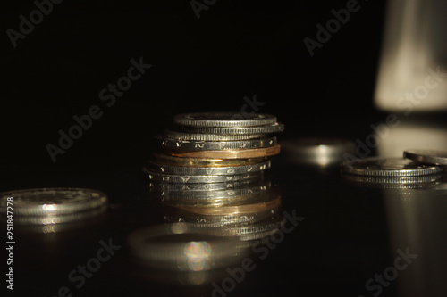 coins on brown and black background