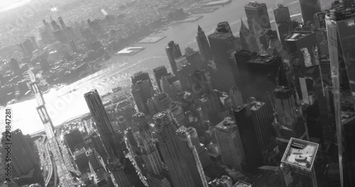 Black and White aerial shot, Brooklyn bridge pan to One World Trade Center and Financial District zoom-in, drone