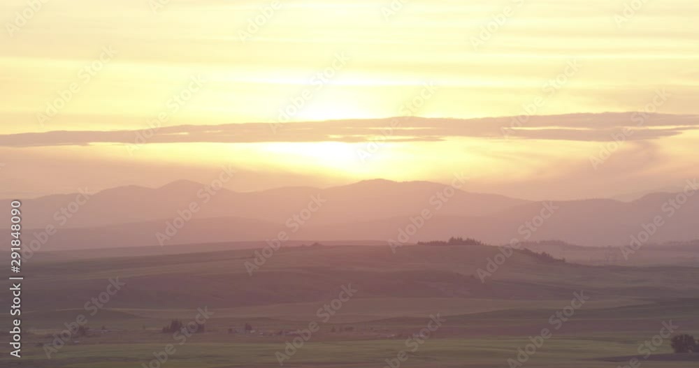 Helicopter aerial shot of sunset over green fields, drone Helicopter aerial shot of sunset over green fields, drone