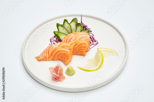 Salmon sashimi set in white plate on white background. Delicious Japanese sashimi set.