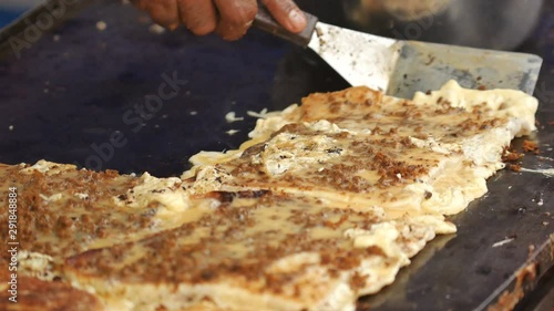 man preparing murtabak an asian local food in stall