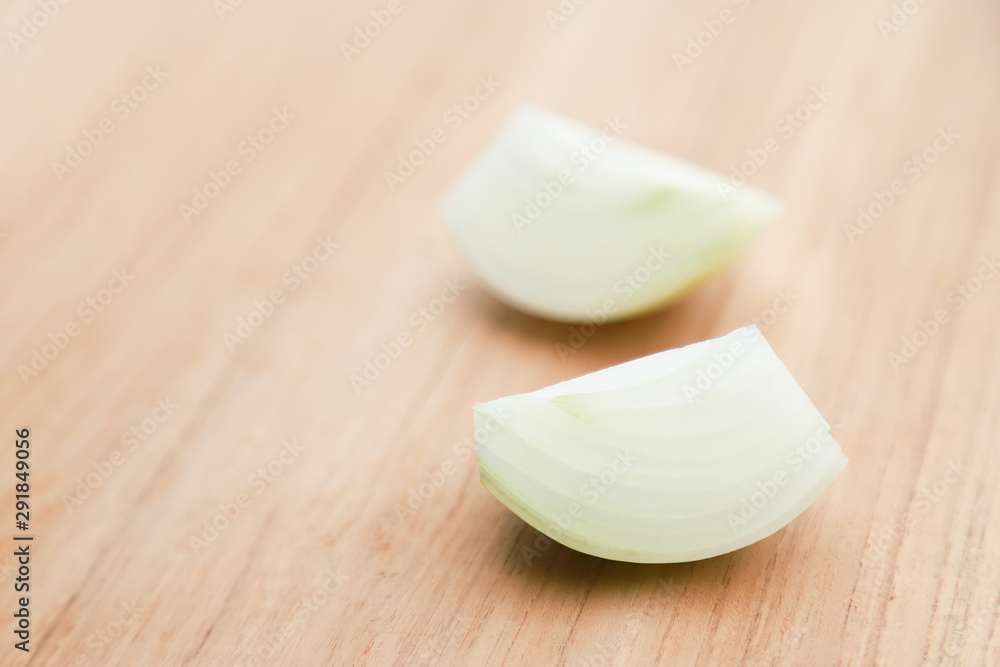 onion big slice on wooden table onion big slice on wooden table