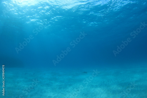 Blue underwater background photo of sea and sand  © Richard Carey