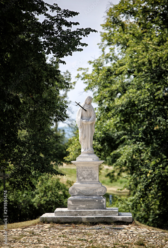 Statue of Saint-Marry with sword in chest