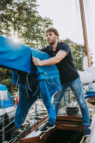 Man preparing boat for sailing