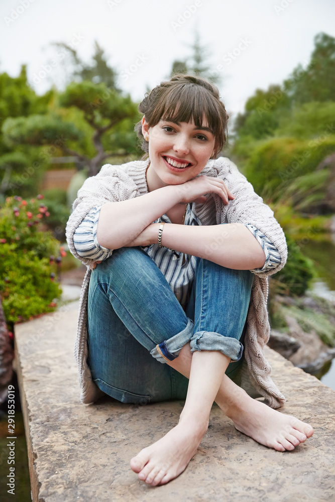 Woman relaxing in Japanese garden Woman relaxing in Japanese garden