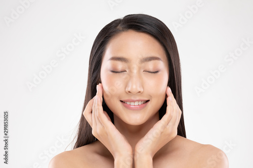 Beautiful Asian woman touching soft cheek smile with clean and fresh skin Happiness and cheerful with positive emotional,isolated on white background,Beauty and Cosmetics Concept