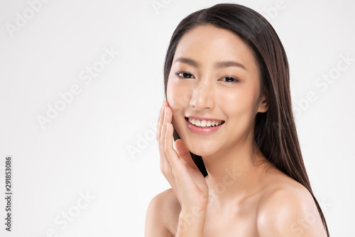 Beautiful Asian woman touching soft cheek smile with clean and fresh skin Happiness and cheerful with positive emotional,isolated on white background,Beauty and Cosmetics Concept