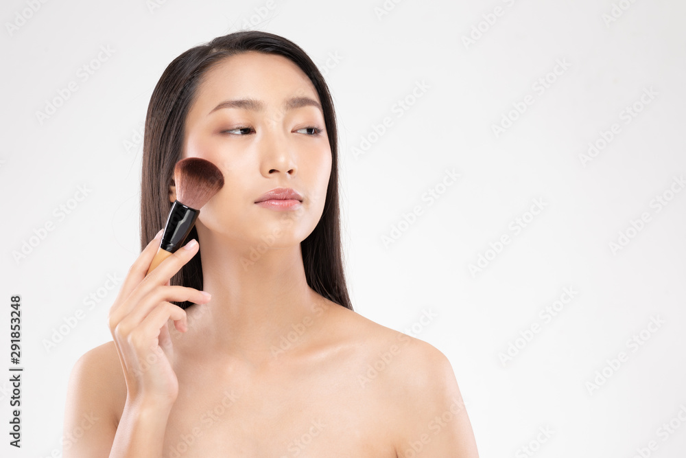 Beautiful Asian young woman smile and holding make up brush with healthy Clean and Fresh skin feeling so happiness and cheerful,Isolated on white background,Beauty Cosmetics Concept Beautiful Asian young woman smile and holding make up brush with healthy Clean and Fresh skin feeling so happiness and cheerful,Isolated on white background,Beauty Cosmetics Concept