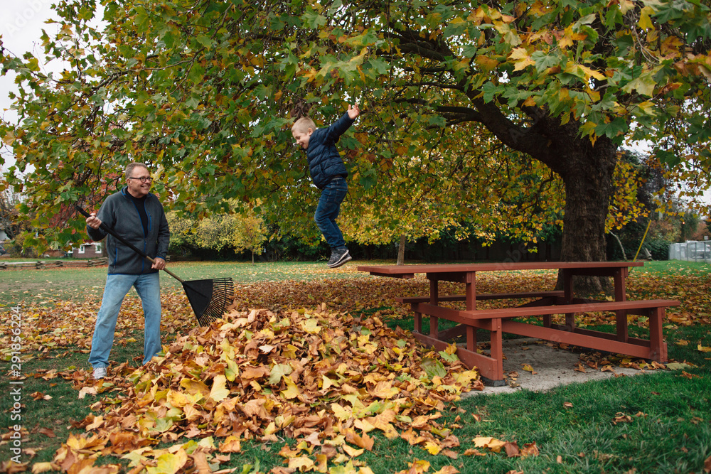Grandpa playing with grandchild outside Grandpa playing with grandchild outside