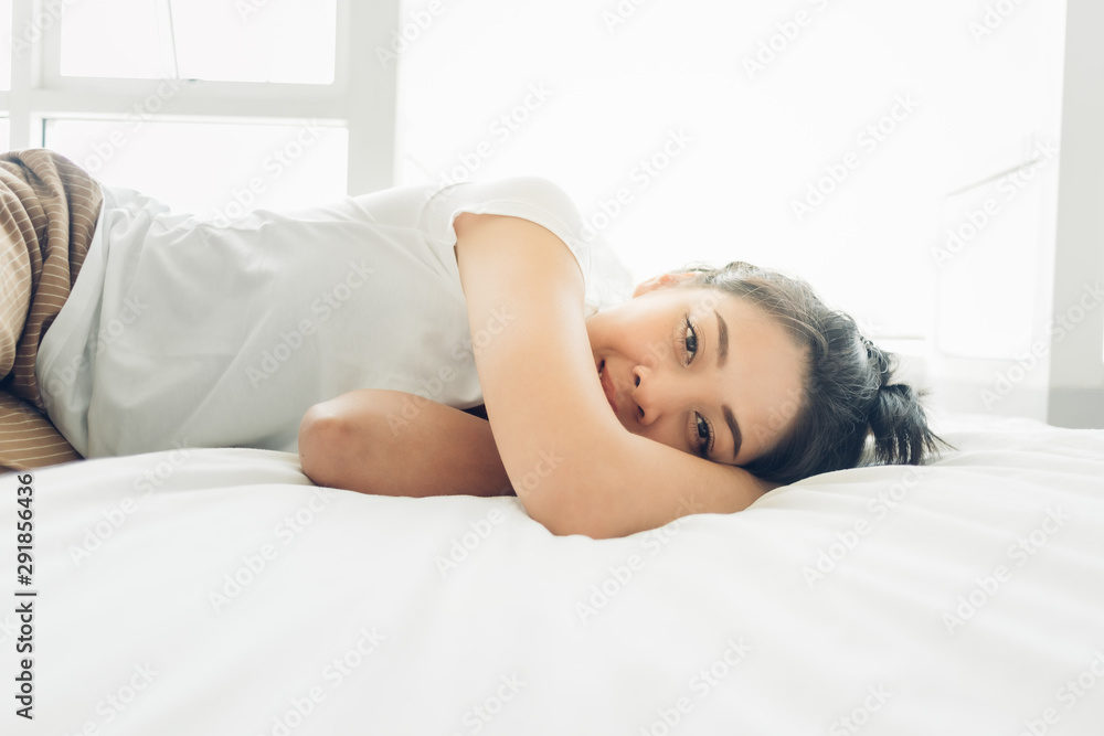 Asian woman is sleeping on her white cozy bed. Asian woman is sleeping on her white cozy bed.