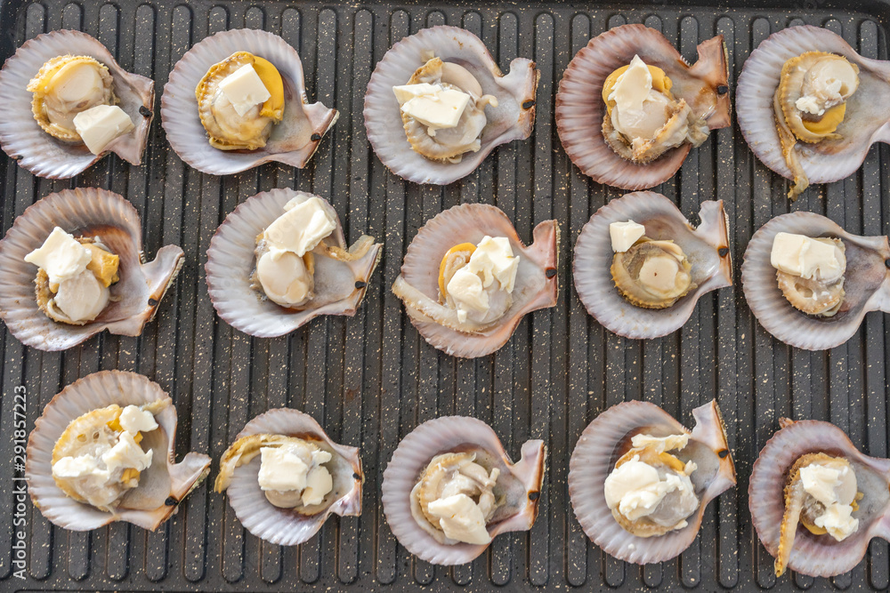 Grilling fresh scallops on electric stove at home Grilling fresh scallops on electric stove at home