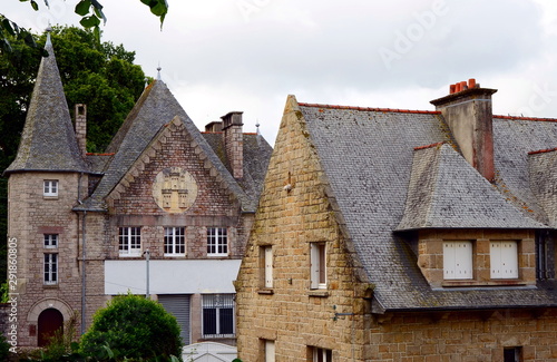 Old historical stone building in a Breton town Dinan, Brittany, France. The medieval town on the hilltop has many fine old buildings. The town retains a large section of the city walls.