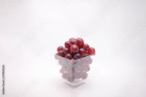 thai purple grapes with leaves isolated on white blackgound photo