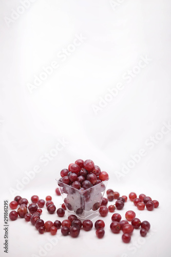 thai purple grapes with leaves isolated on white blackgound photo