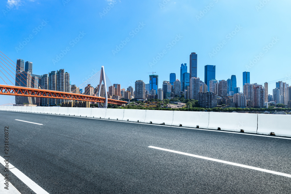 Empty asphalt road and Chongqing architectural landscape with bridge